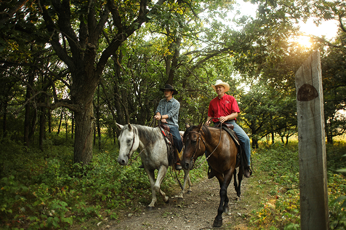 Riding horses at Sheyenne Oaks