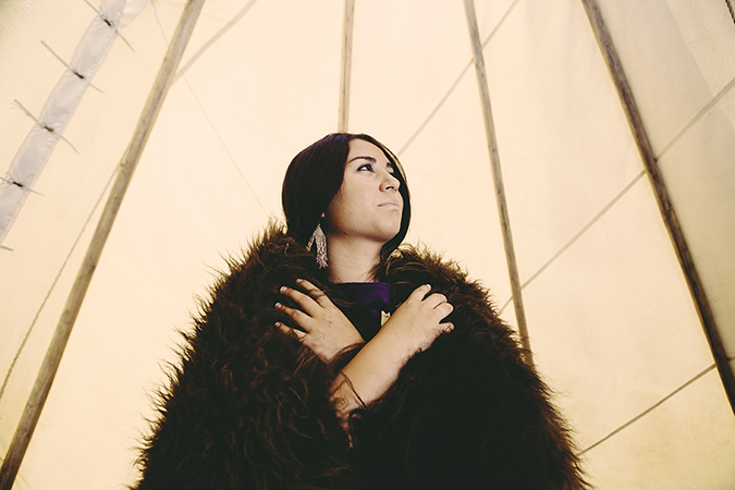 Native American woman glancing up