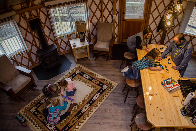 Family playing games in the yurt