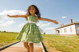 Girl runs on boardwalk at Fort Buford State Historic Site