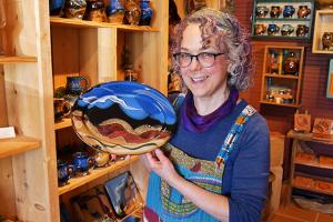 Tama Smith holding her pottery