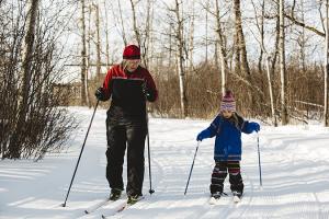 Lady and child cross coutry skiing