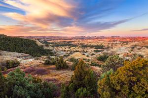 Vibrant fall colors offset the Little Missouri River in the north unit of Theodore Roosevelt National Park