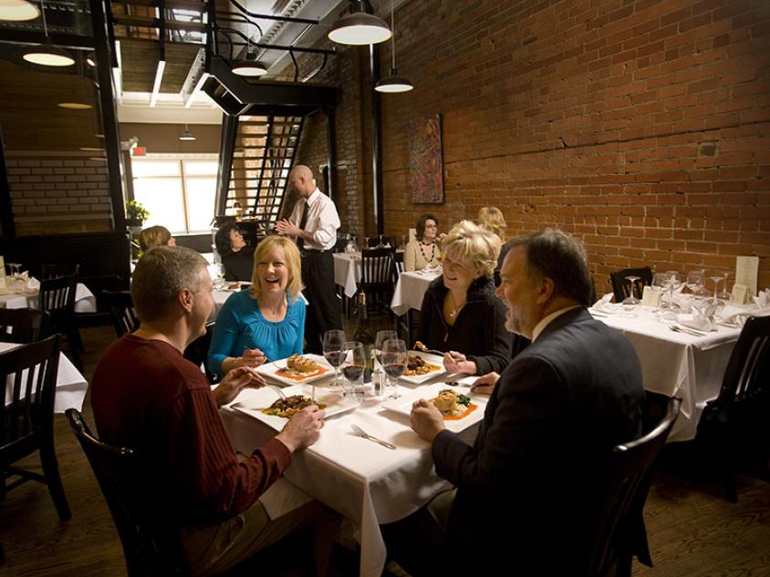 People at a table dinging at The Brickhouse in Dickinson
