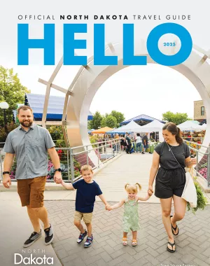 2025 Travel Guide with family walking hand in hand cover