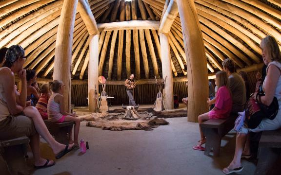 A local Native American story teller gives a flute concert and historical interpretation at Fort Abraham Lincoln State Park