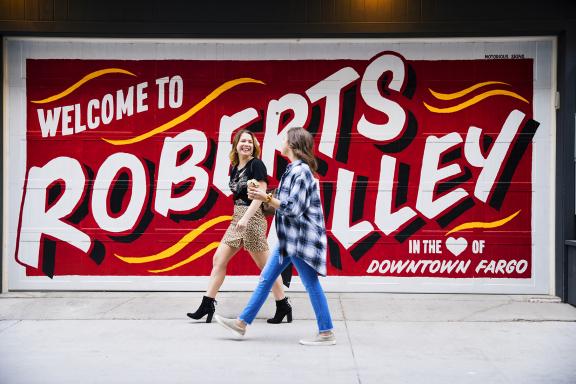 Girls walking past Roberts Ally in Fargo
