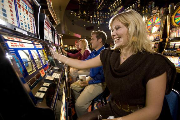 People playing slot machines