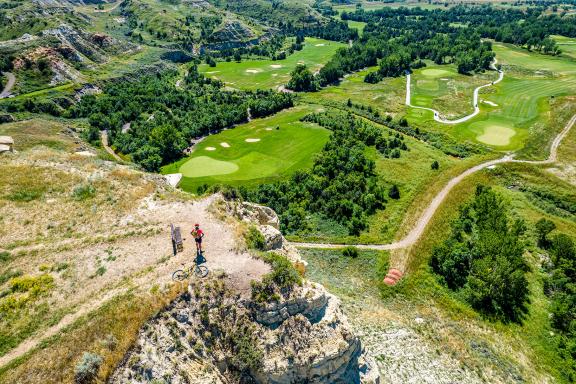 Maah Daah Hey Trail with view of golf course