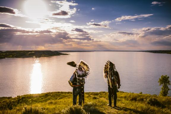 two men overlooking a lake