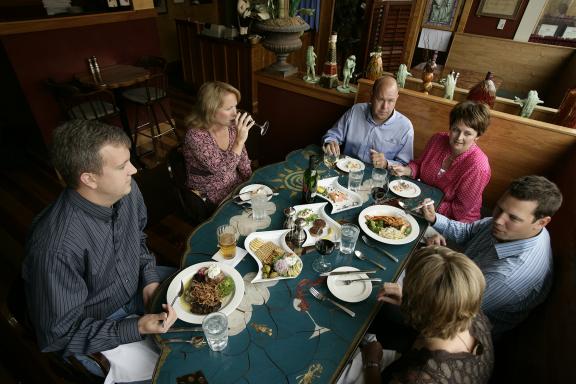 Diners enjoying a meal at a cozy restaurant