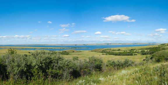 A scenic view of Four Mile Creek with grassy hills