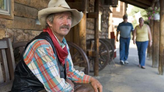 Cowboy Lyle visiting with tourists in Medora, N.D.