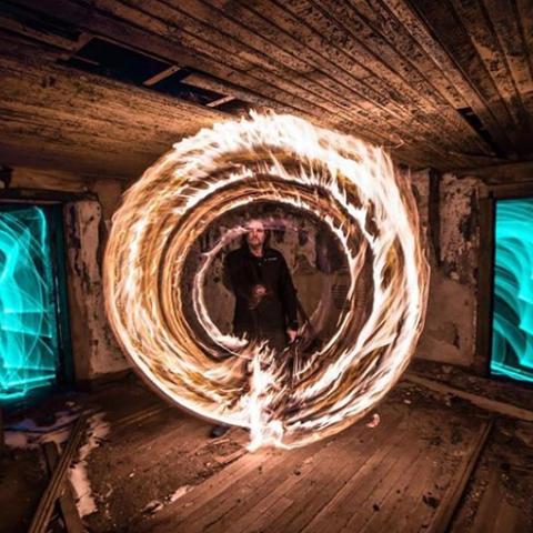 Photo of Daniel creating light circles