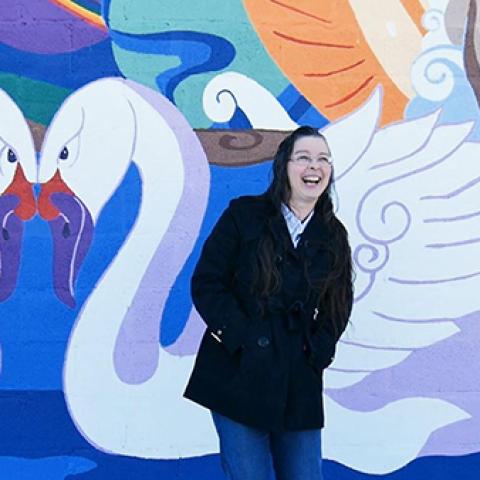Photo of Melissa Gordon in front of her mural