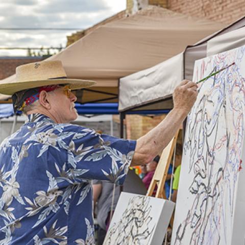 Photo of Walter Piehl painting