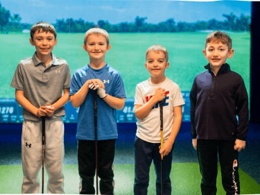 kids golfing at the bunker photo