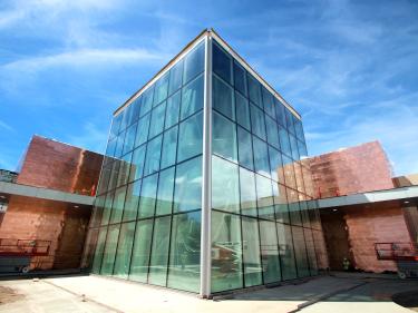 the only design of its kind in the nation, the stunning steel and glass northern lights atrium welcomes visitors to the north dakota heritage center. photo