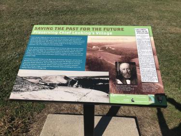 interpretive sign at chief looking's village photo