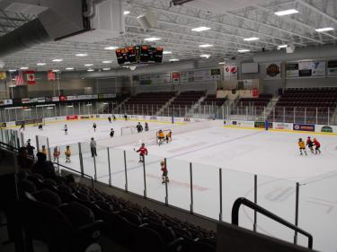 kids playing hockey at the maysa arena photo