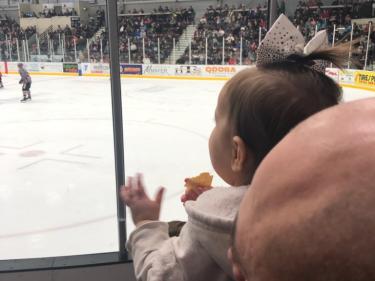 watching hockey game at maysa arena photo