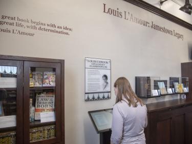 a visitor learning at the louis l'amour kiosk photo