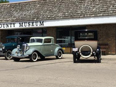 old car in front of the museum photo