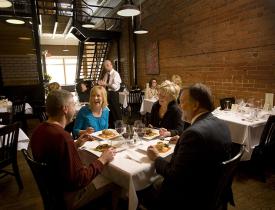 People at a table dinging at The Brickhouse in Dickinson