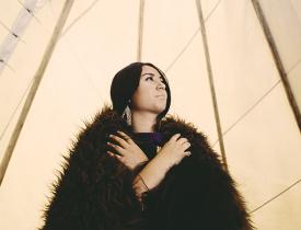 Native American woman glancing up