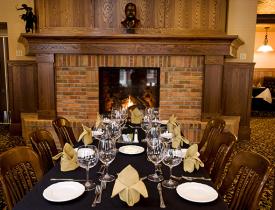 Theodore's Dining Room restaurant table set up near the fireplace