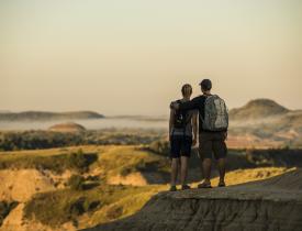 Hikers looking at Badlands