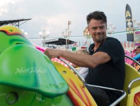 Man rides an amusement park ride