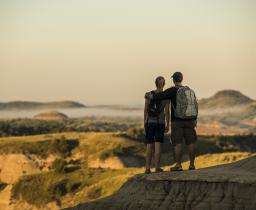 Hikers looking at Badlands