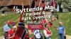 syttende mai parade and park opening day. scandinavian heritage celebration with parade participants holding norwegian flags in traditional costume on green park grounds. photo