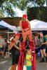 child with entertainers at downtown street fair photo 2